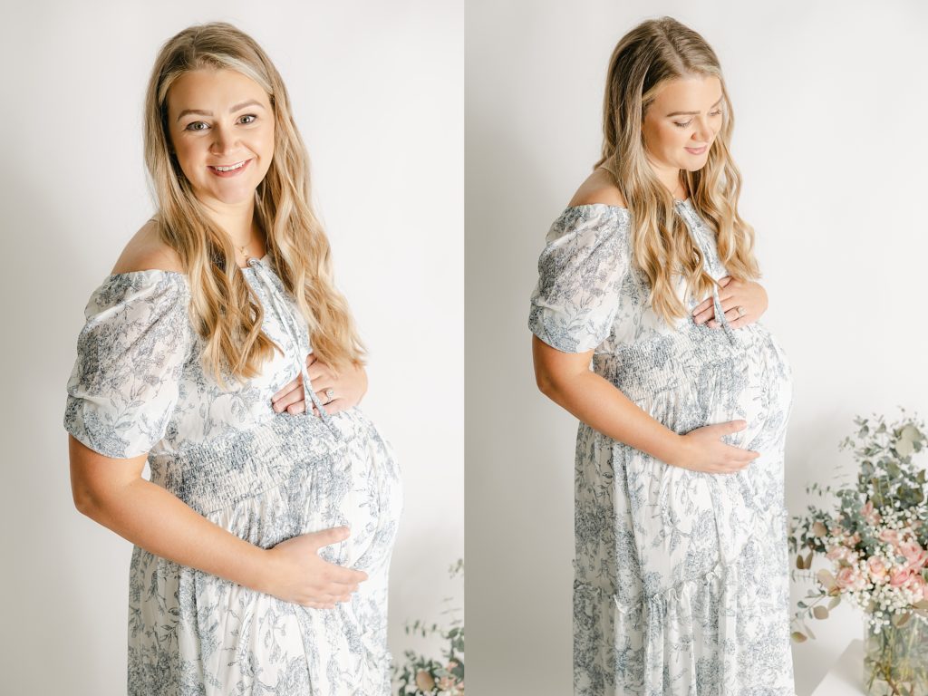 indianapolis studio maternity photography session, mother holding baby bump in blue floral dress