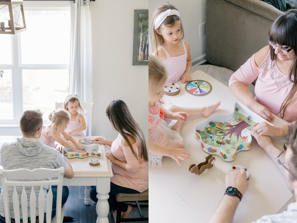 Indianapolis lifestyle family photographer, family playing board games at their white dining room table