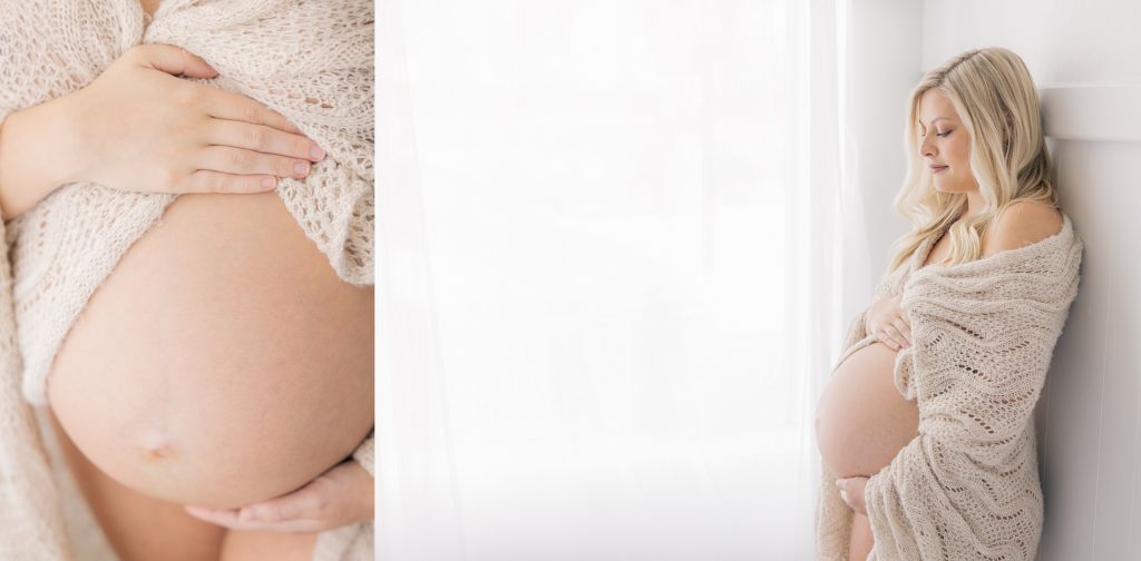 Indianapolis Studio Maternity Photographer, intimate maternity session, third trimester, mother holding belly in front of window while draped in blanket 