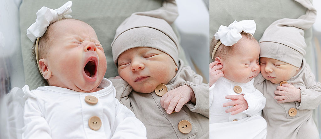Newborn baby twins sleep and yawn with each other