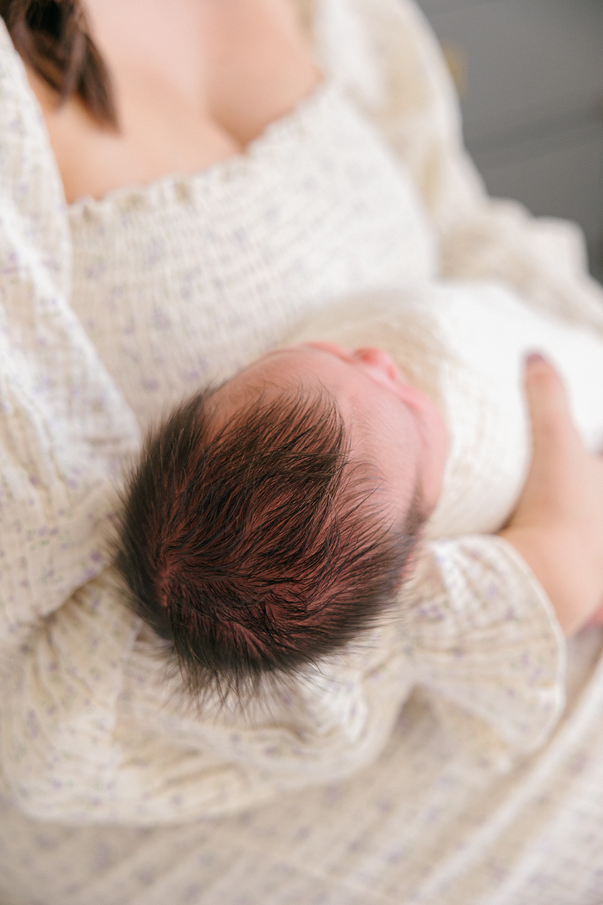 Close up of newborn baby's dark brown hair, Fishers newborn photographer